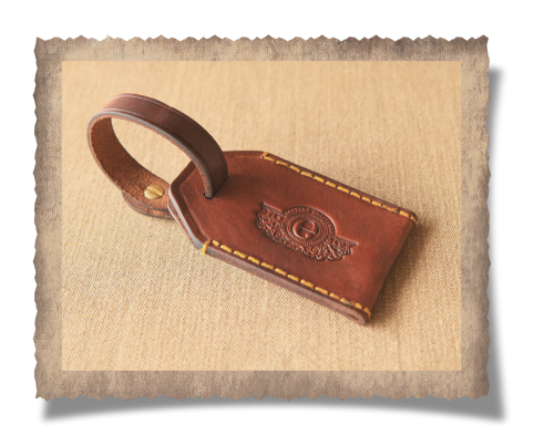 The Matjiesfontein Gun Case & Luggage Tag, logo, yellow stitching, leather products, handcrafted, luggage tag