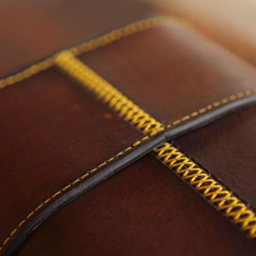 yellow stitching, leather carrier, leather, glass carrier