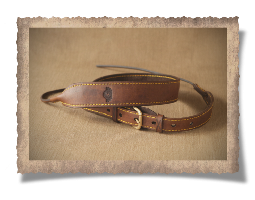 The Wilderness Leather Rifle Sling, leather, yellow stitching, brass buckles, sling