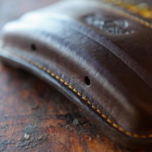 The Somerset Double Rifle Cartridge Pouch, yellow stitching, logo, holes, leather product, handcrafted